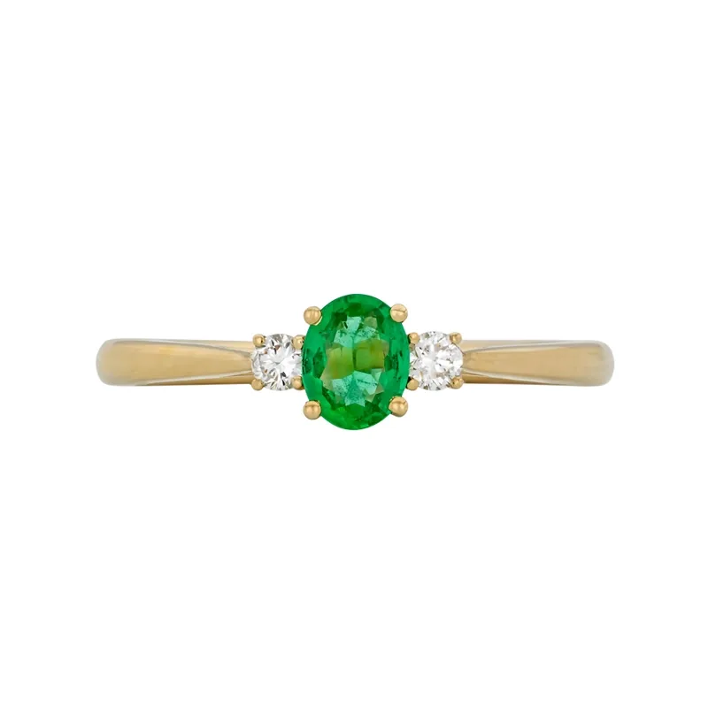 Anillo en oro amarillo de 18 Kilates, con esmeralda central de 0.30 Ct y decoración en diamantes de 0.09 Ct