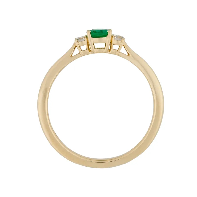 Anillo en oro amarillo de 18 Kilates, con esmeralda central de 0.30 Ct y decoración en diamantes de 0.09 Ct