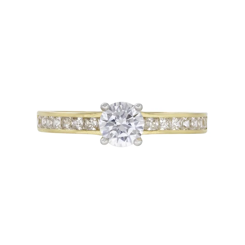Anillo en oro amarillo de 18 Kilates, con zircón central y decoración en zircones