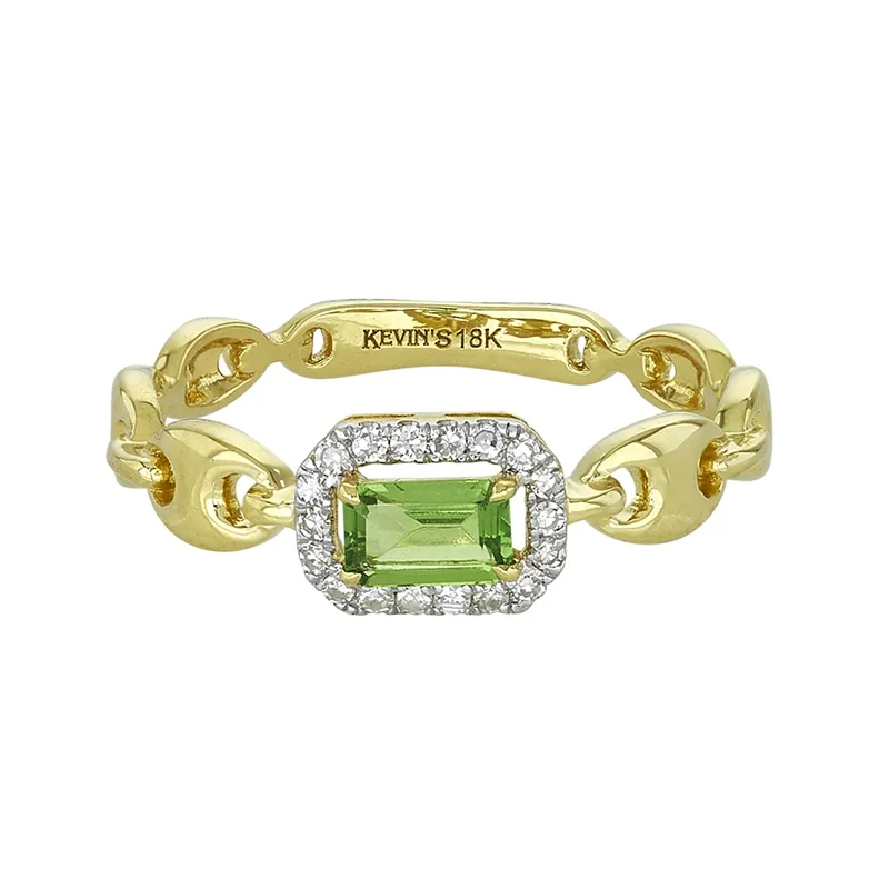 Anillo en oro amarillo de 18 Kilates, con granate central y decoración en diamantes de 0.09 Ct