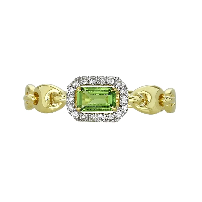 Anillo en oro amarillo de 18 Kilates, con granate central y decoración en diamantes de 0.09 Ct