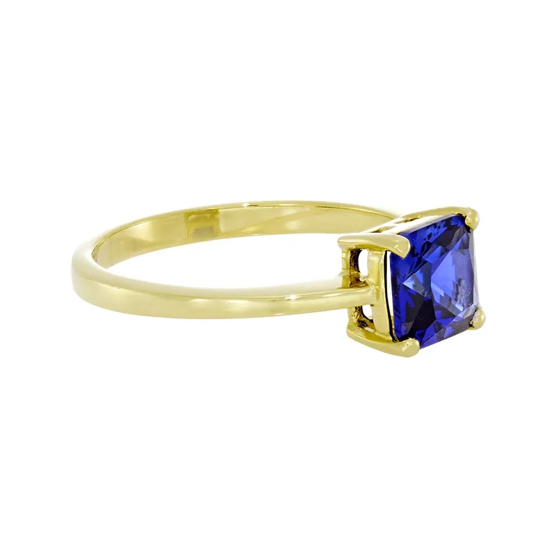 Anillo con zafiro laboratorio central princess de 1.25Ct, oro tono amarillo 18k