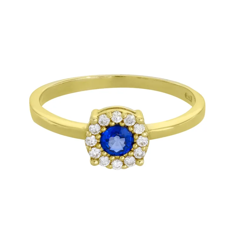 Anillo en oro amarillo de 18 Kilates, con zafiro central de 0.32 Ct y decoración en diamantes de 0.12 Ct