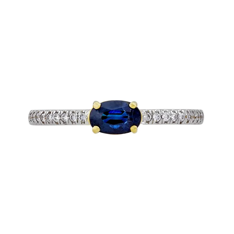 Anillo en oro amarillo de 18 Kilates, con zafiro central de 0.52 Ct y decoración en diamantes de 0.10 Ct