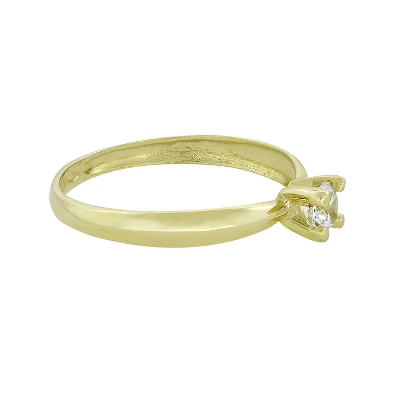 Anillo con zircon central redondo, oro tono amarillo 18k, liso
