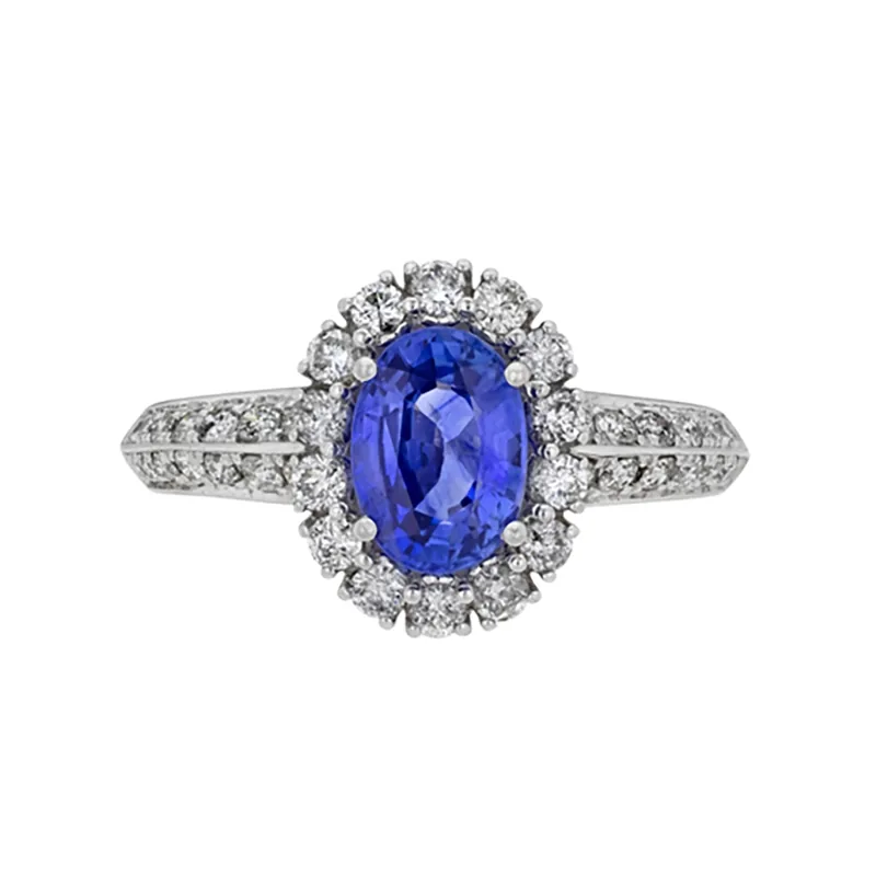 Anillo en oro blanco de 18 Kilates, con zafiro central de 1.00 Ct y decoración en diamantes de 0.50 Ct