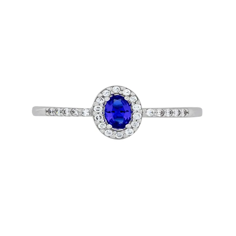 Anillo en oro blanco de 18 Kilates, con zircón col central y decoración en zircones