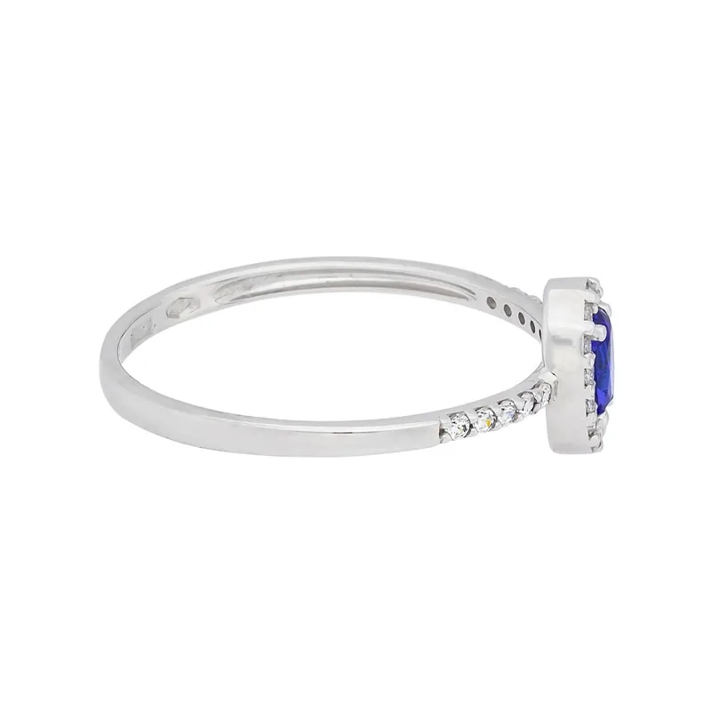 Anillo en oro blanco de 18 Kilates, con zircón col central y decoración en zircones