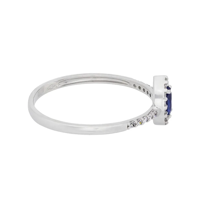 Anillo en oro blanco de 18 Kilates, con zircón col central y decoración en zircones