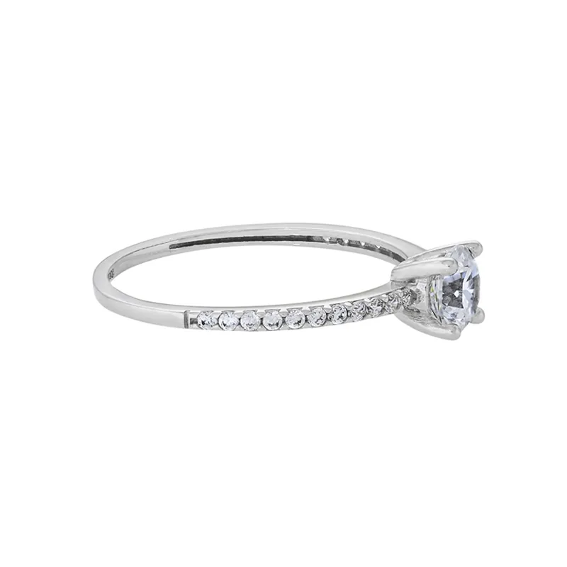 Anillo en oro blanco de 18 Kilates, con zircón central y decoración en zircones