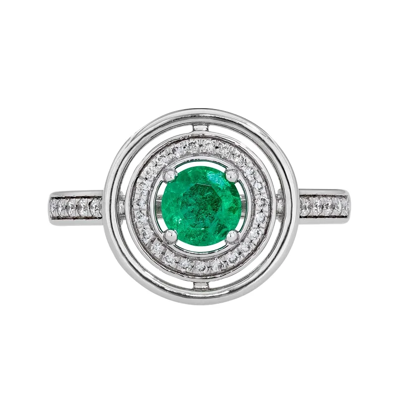 Anillo en oro blanco de 18 Kilates, con esmeralda central de 0.42 Ct y decoración en diamantes de 0.16 Ct