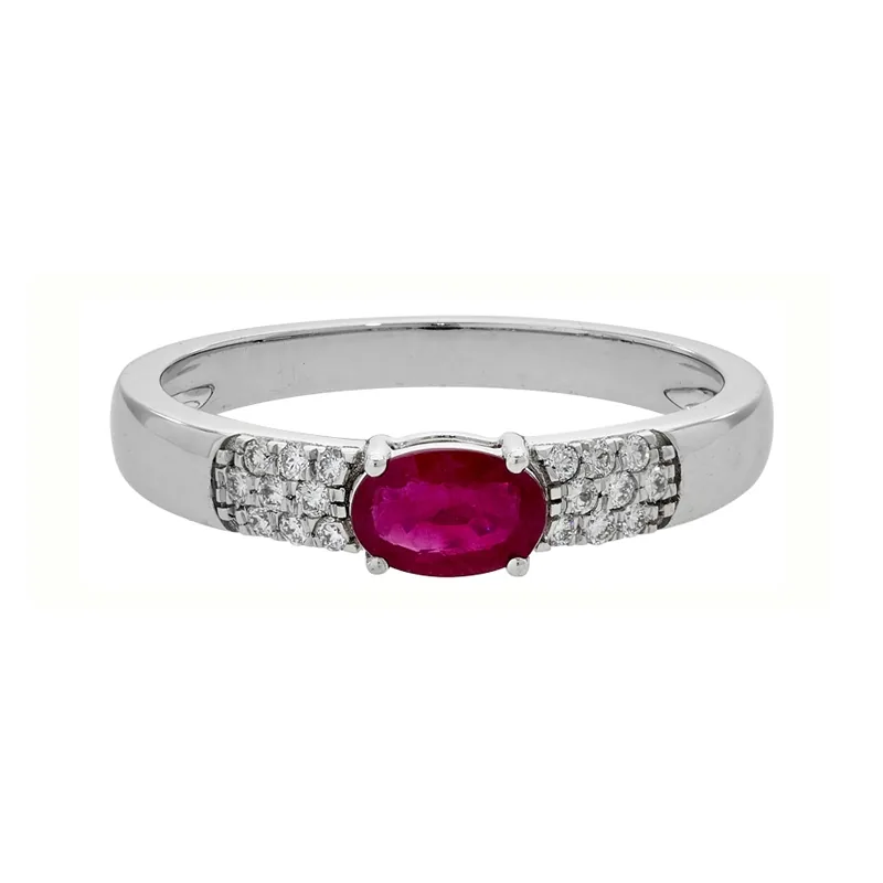 Anillo en oro blanco de 18 Kilates, con rubí central de 0.50 Ct y decoración en diamantes de 0.12 Ct