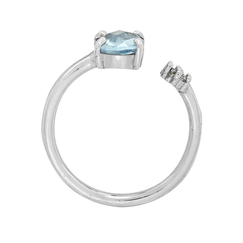 Anillo en oro blanco de 18 Kilates, con topacio central y decoración en zircones