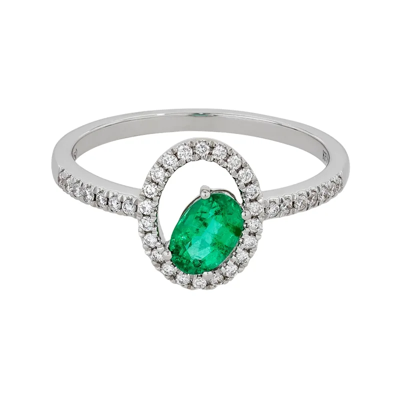 Anillo en oro blanco de 18 Kilates, con esmeralda central de 0.40 Ct y decoración en diamantes de 0.16 Ct