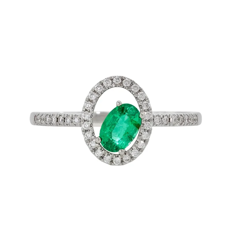 Anillo en oro blanco de 18 Kilates, con esmeralda central de 0.40 Ct y decoración en diamantes de 0.16 Ct