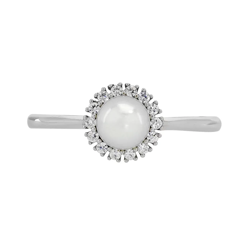 Anillo en oro blanco de 18 Kilates, con perla central de 5 mm de ancho aprox y decoración en zircones