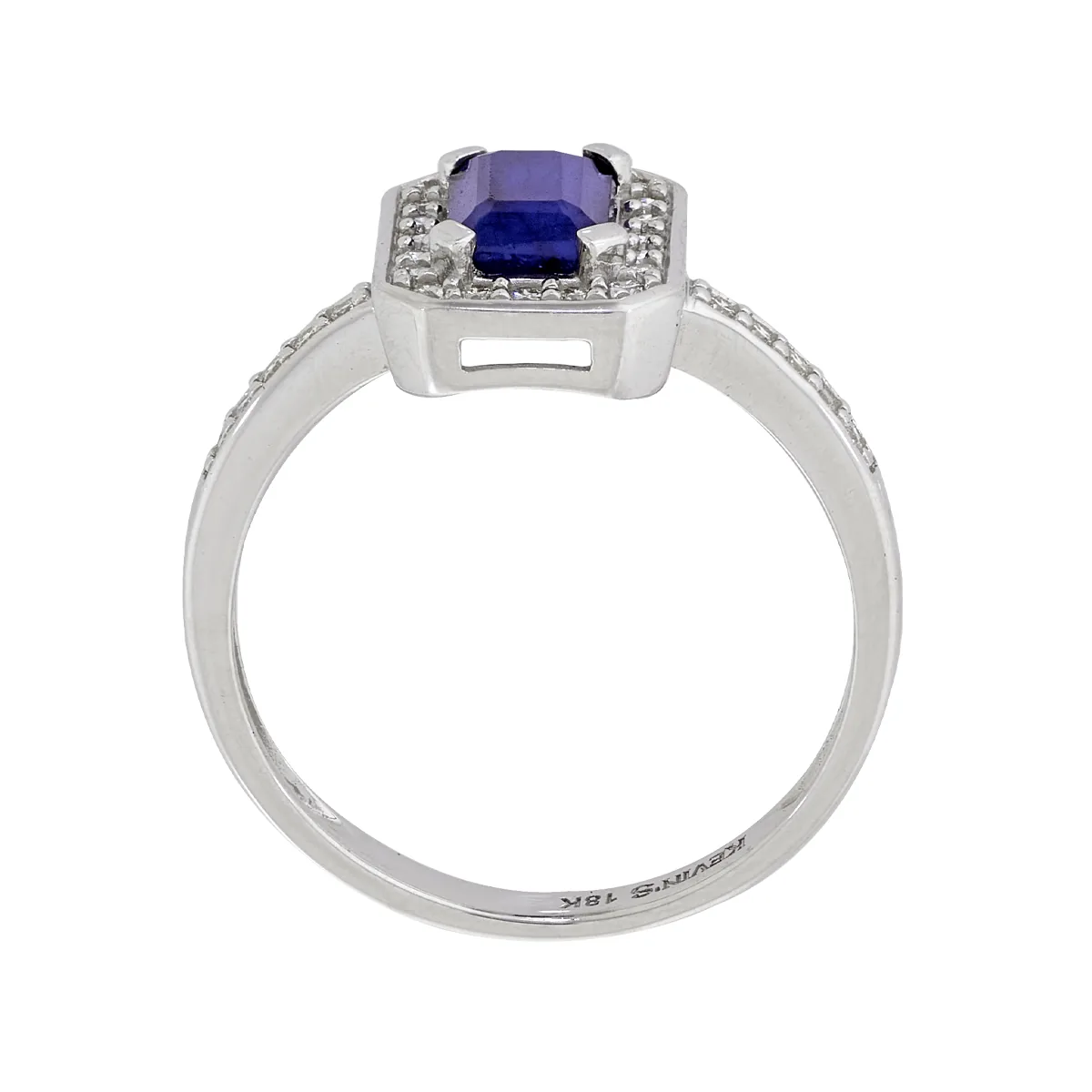 Anillo en oro blanco de 18 Kilates, con zafiro central de 0.60 Ct y decoración en diamantes de 0.15 Ct