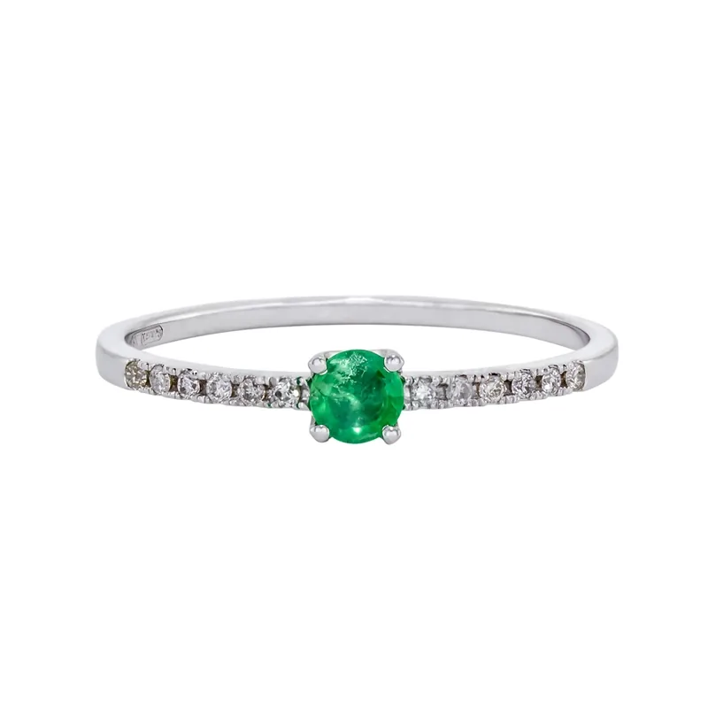 Anillo en oro blanco de 18 Kilates, con esmeralda central de 0.15 Ct y decoración en diamantes de 0.06 Ct