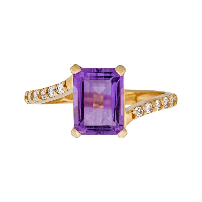 Anillo en oro rojo de 18 Kilates, con amatista central y decoración en zircones