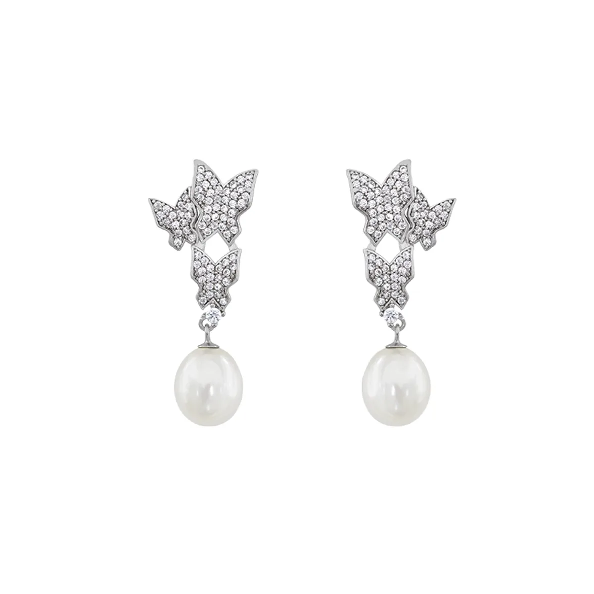 Aretes de mariposa en plata Ley 925,  con perlas centrales de 8 mm de ancho aprox y decoración en zircones - Colección Sueños