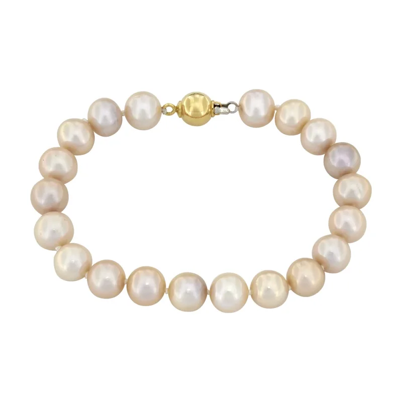 Pulsera con perlas de 8 mm de ancho aprox con broche en oro amarillo de 18 Kilates, 19 cm. de largo