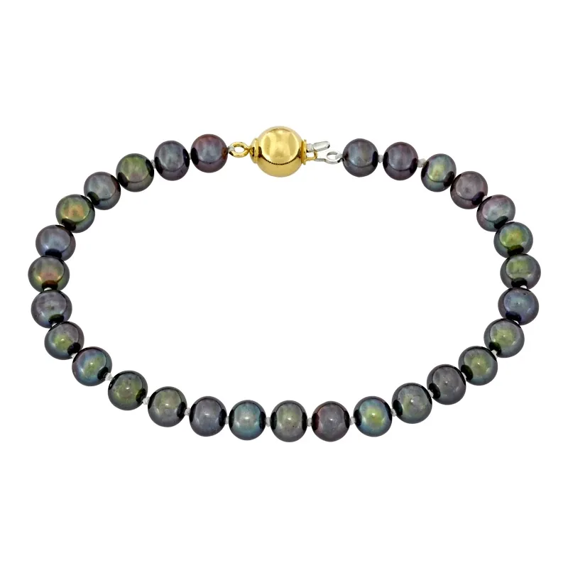 Pulsera con perlas de 6 mm de ancho aprox con broche en oro amarillo de 18 Kilates, 19 cm. de largo