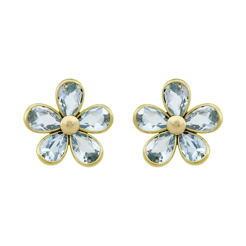Topos de flores en oro amarillo de 18 Kilates, con topacios