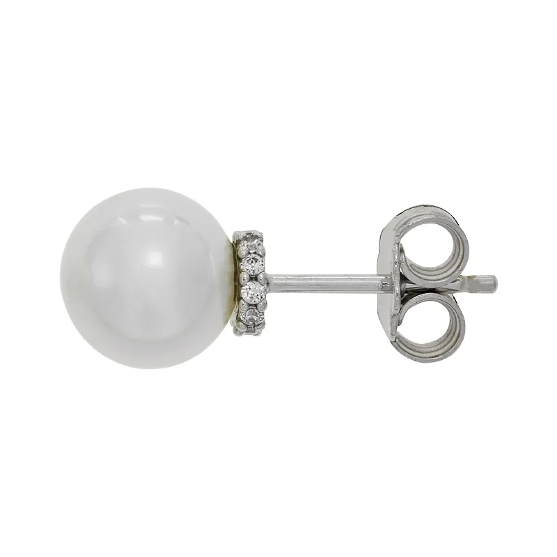 Topos en oro blanco de 18 Kilates, con perlas centrales de 7.50 mm de ancho aprox y decoración en zircones