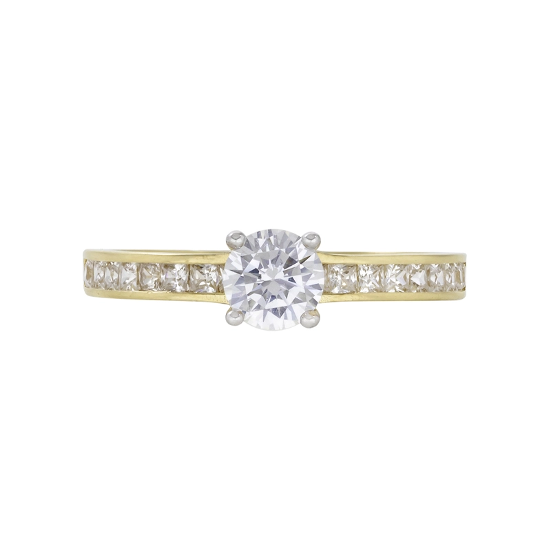 Anillo en oro amarillo de 18 Kilates, con zircón central y decoración en zircones