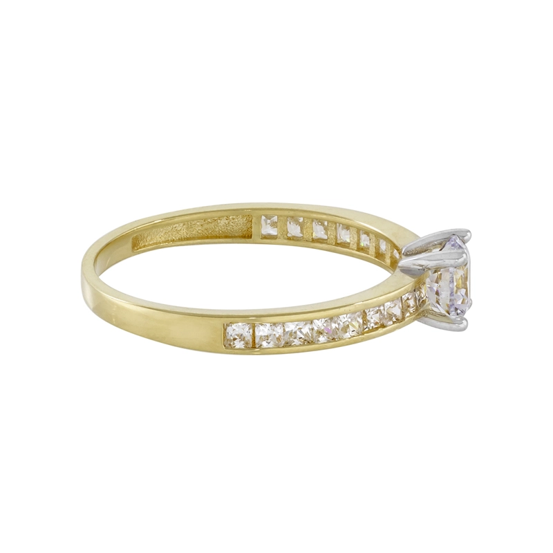 Anillo en oro amarillo de 18 Kilates, con zircón central y decoración en zircones