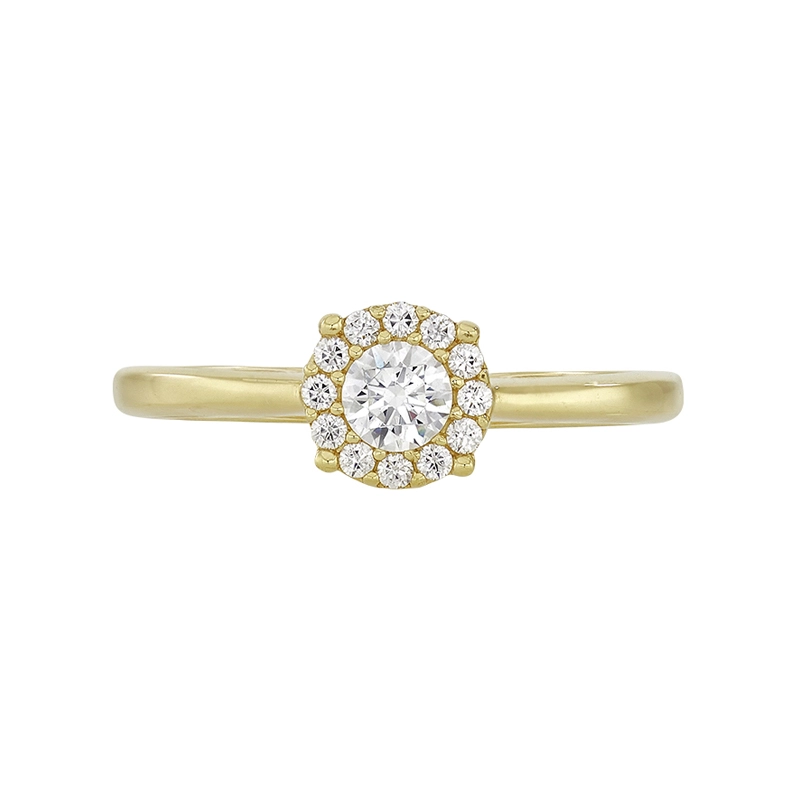 Anillo en oro amarillo de 18 Kilates, con zircón central y decoración en zircones