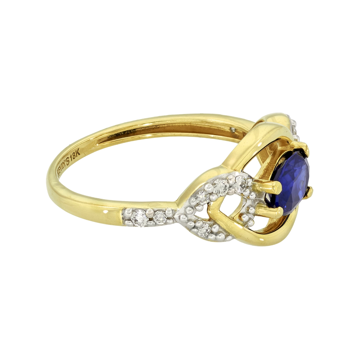 Anillo en oro amarillo de 18 Kilates, con zafiro central de 0.90 Ct y decoración en diamantes de 0.18 Ct