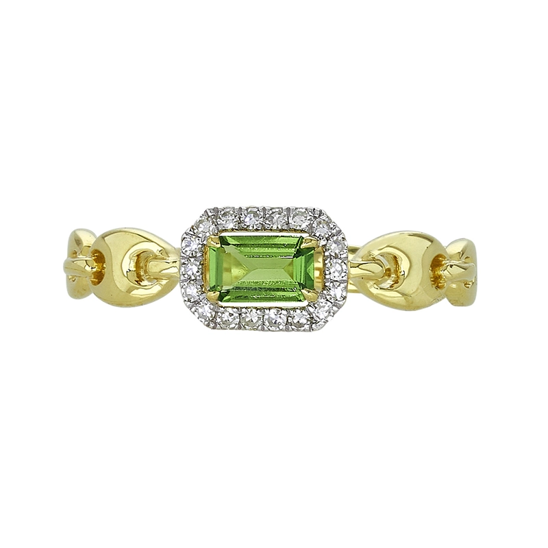 Anillo en oro amarillo de 18 Kilates, con granate central y decoración en diamantes de 0.09 Ct