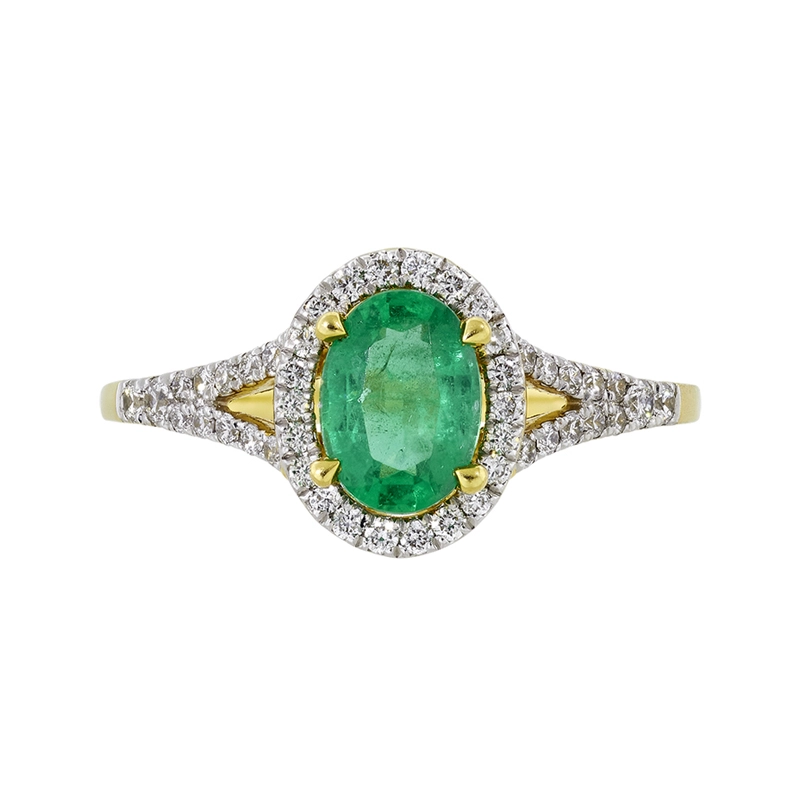Anillo en oro amarillo de 18 Kilates, con esmeralda central de 0.65 Ct y decoración en diamantes de 0.25 Ct