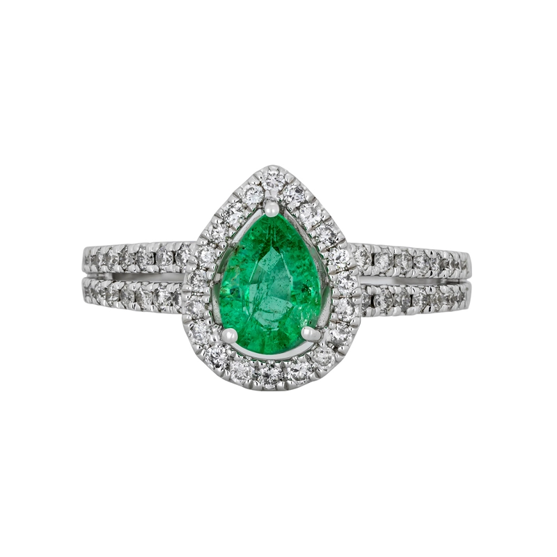 Anillo en oro blanco de 18 Kilates, con esmeralda central de 0.60 Ct y decoración en diamantes de 0.35 Ct