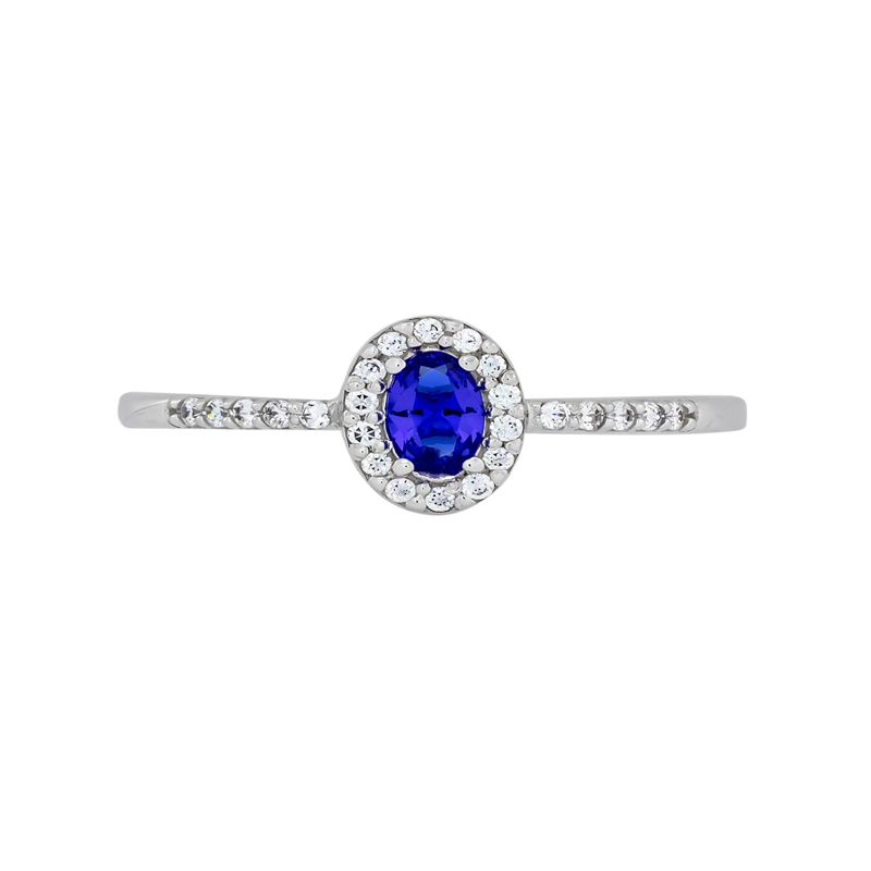 Anillo en oro blanco de 18 Kilates, con zircón col central y decoración en zircones