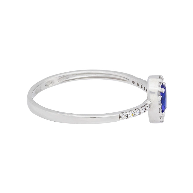 Anillo en oro blanco de 18 Kilates, con zircón col central y decoración en zircones