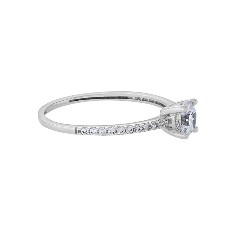 Anillo en oro blanco de 18 Kilates, con zircón central y decoración en zircones
