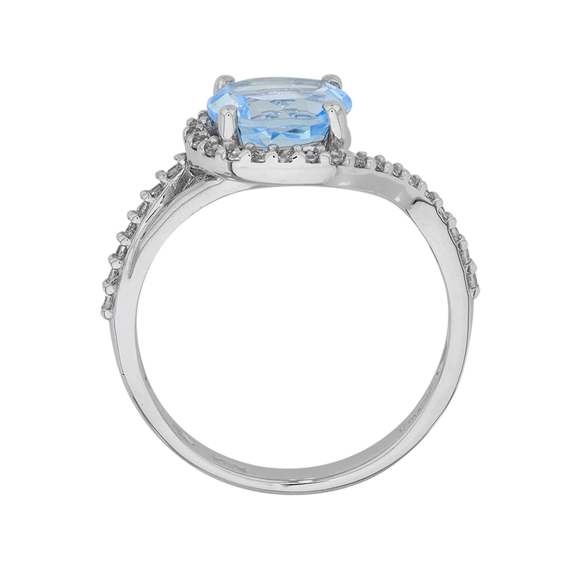 Anillo en oro blanco de 18 Kilates, con topacio central y decoración en zircones