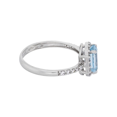 Anillo en oro blanco de 18 Kilates, con topacio central y decoración en zircones