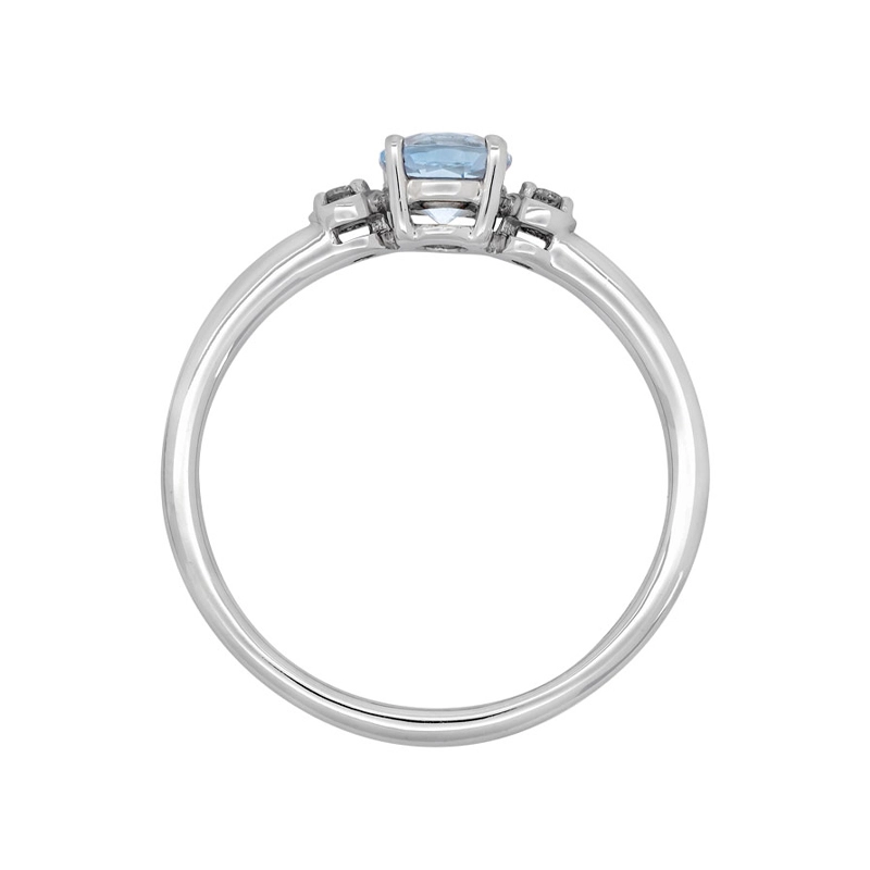 Anillo en oro blanco de 18 Kilates, con topacio central de 0.61 Ct y decoración en diamantes de 0.05 Ct