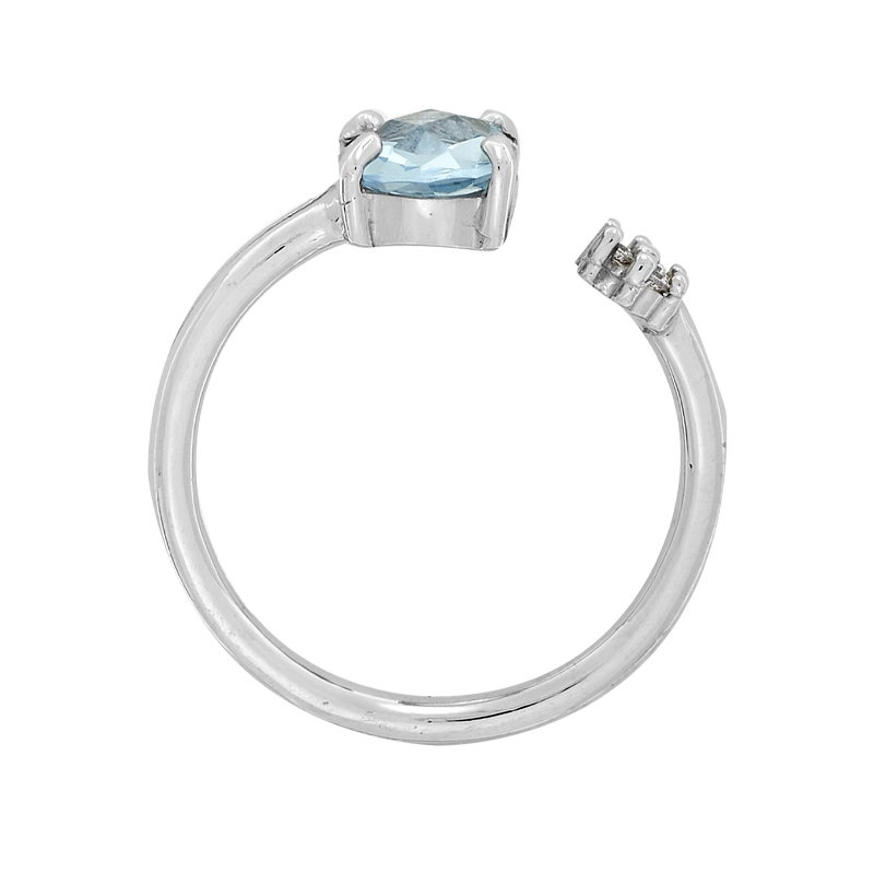Anillo en oro blanco de 18 Kilates, con topacio central y decoración en zircones