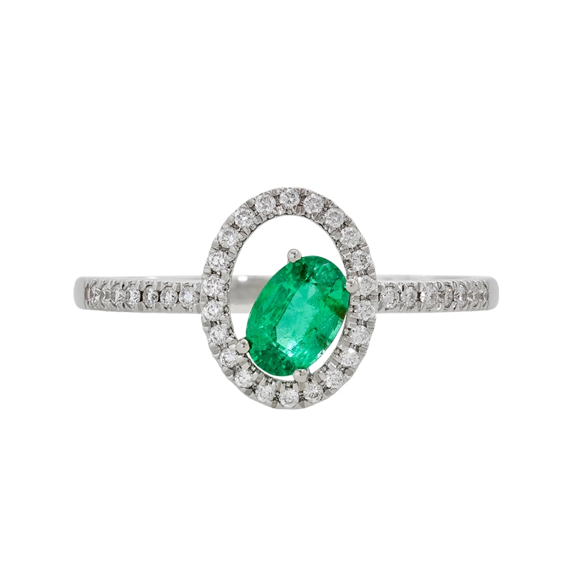 Anillo en oro blanco de 18 Kilates, con esmeralda central de 0.40 Ct y decoración en diamantes de 0.16 Ct