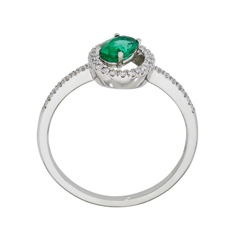 Anillo en oro blanco de 18 Kilates, con esmeralda central de 0.40 Ct y decoración en diamantes de 0.16 Ct
