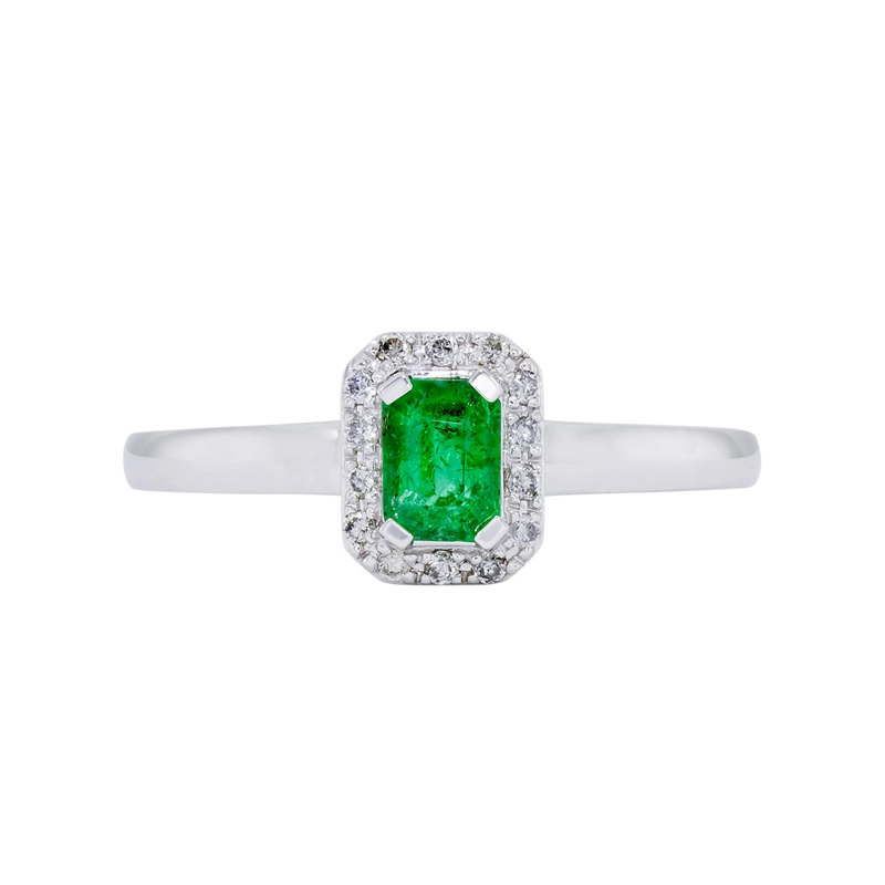 Anillo en oro blanco de 18 Kilates, con esmeralda central de 0.50 Ct y decoración en diamantes de 0.08 Ct