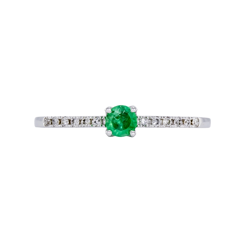 Anillo en oro blanco de 18 Kilates, con esmeralda central de 0.15 Ct y decoración en diamantes de 0.06 Ct
