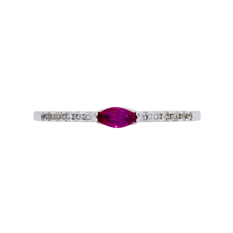 Anillo en oro blanco de 18 Kilates, con rubí central de 0.15 Ct y decoración en diamantes de 0.06 Ct