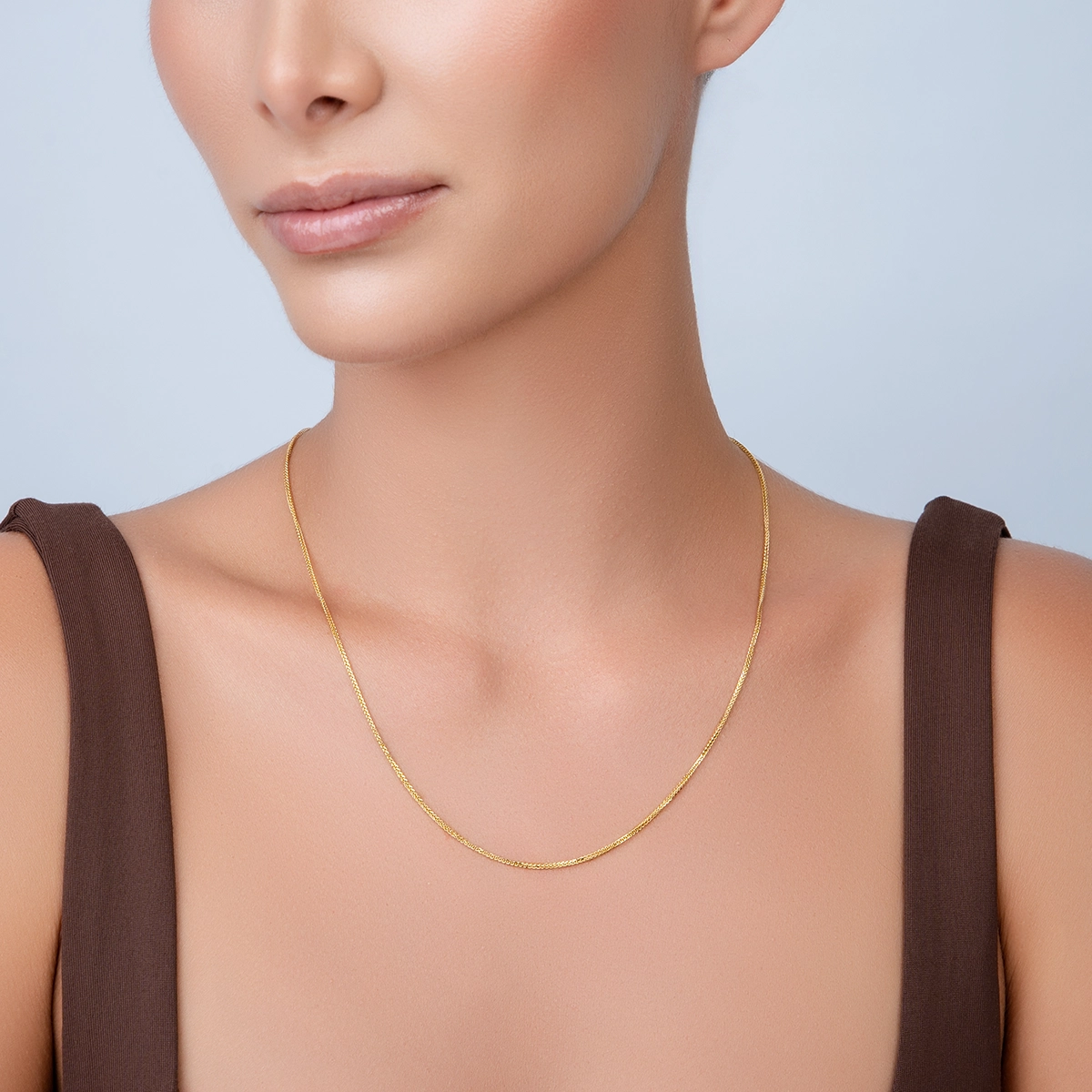 Cadena en oro amarillo de 18 Kilates con visos, Espiga, 50 cm. de largo, 1 mm. de ancho