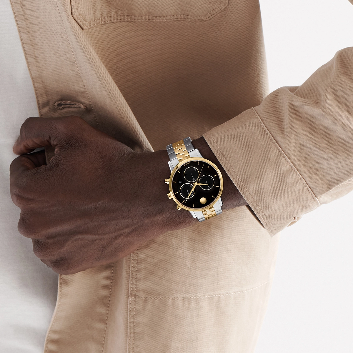 Reloj Movado análogo, para Hombre, tablero redondo colores negro y dorado, estilo index, pulso acero colores plateado y dorado, calendario, cronografo