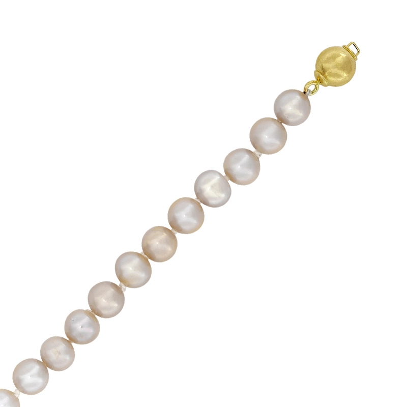 Pulsera con perlas de 7 mm de ancho aprox con broche en oro amarillo de 18 Kilates, 19 cm. de largo